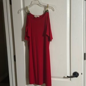 Micheal Kors size M red color with black leather straps and gold shoulder